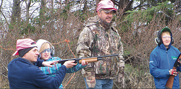 Ten-year-old Hannah Sobkow was the youngest shooter from the Lamont Fish and Game Association at the trap shoot on Saturday, April 23. Here she gets some support from her Dad Brian. A total of 17 participants attended the annual event at the Mundare Gun Range.